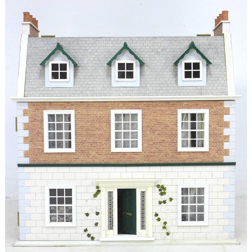 166 - A late 20th century town house style dolls house with basement and dolls house furniture accessories... 