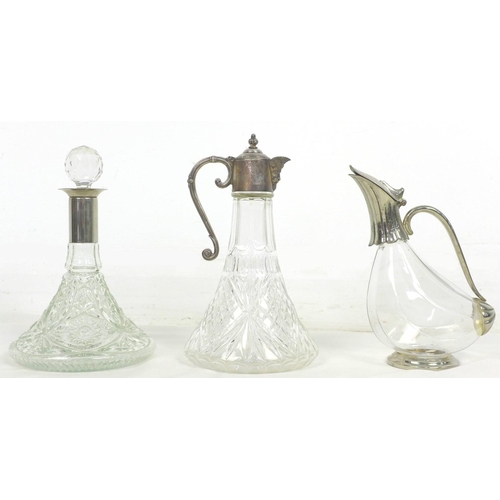 20 - A group of three glass decanters, comprising a ship's decanter with silver plated 'Green Man' mask s... 