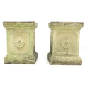 A pair of square form stoneware garden pedestals, each side decorated with a single rose, in possibl... 