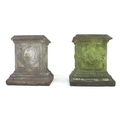 A pair of stoneware garden pedstals, with quatrefoil designs to each side and raised upon stepped ba... 