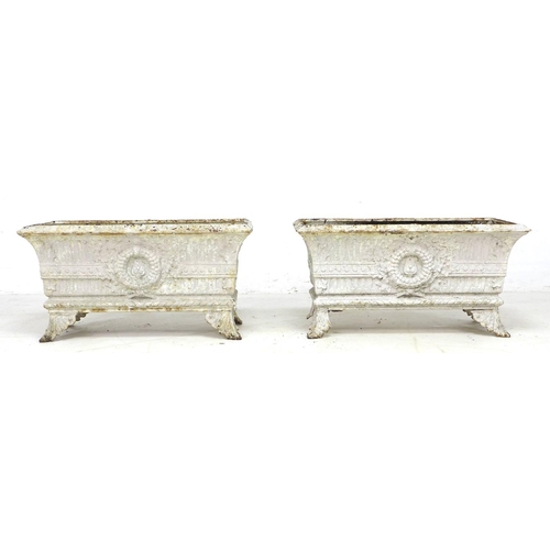 276 - A pair of early 20th century cast iron rectangular planters, each with four outswept feet, with dama... 