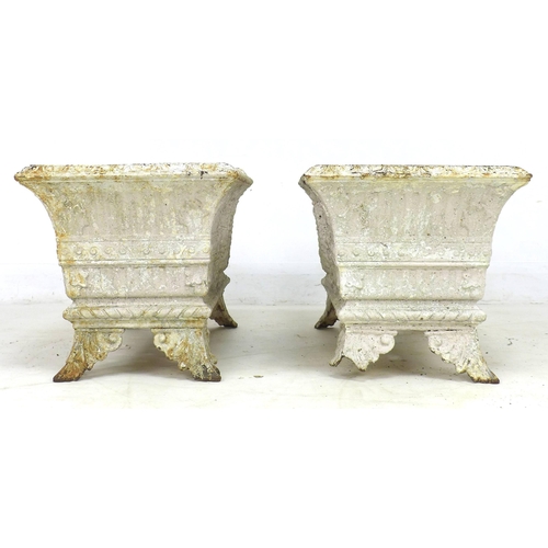 276 - A pair of early 20th century cast iron rectangular planters, each with four outswept feet, with dama... 