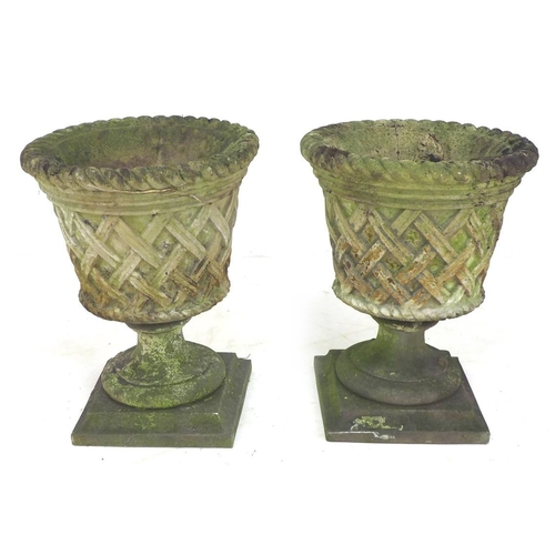 277 - Two stoneware garden urn planters decorated with a woven rush effect with associated bases, urns, 40... 