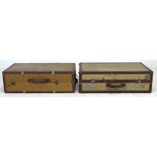 279 - Two vintage travelling trunks, canvas covered and leather bound, one labelled 'The Traveller', 80 by... 