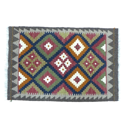 285 - A Maimana Kilim rug, with diamond patterned field in white, orange, green, burgundy, and dark blue, ... 