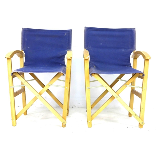 286 - A pair of director style beech frame deck chairs, with blue canvas back rests and seats, 56 by 50 by... 