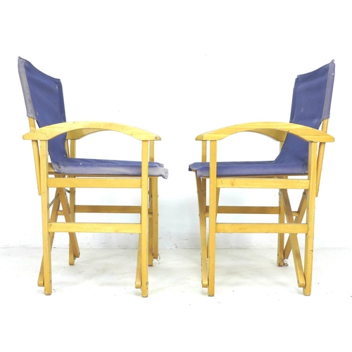 286 - A pair of director style beech frame deck chairs, with blue canvas back rests and seats, 56 by 50 by... 