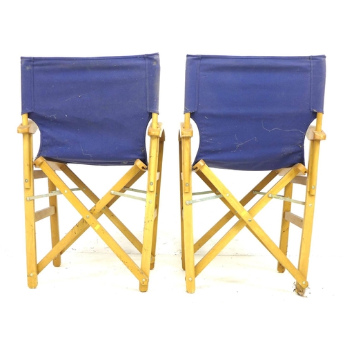 286 - A pair of director style beech frame deck chairs, with blue canvas back rests and seats, 56 by 50 by... 