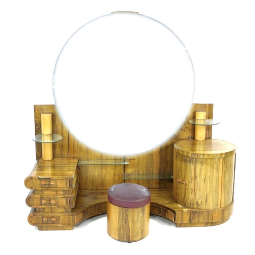 292 - An African ofram wood Art Deco style dressing table, with large circular mirror and an arrangement o... 