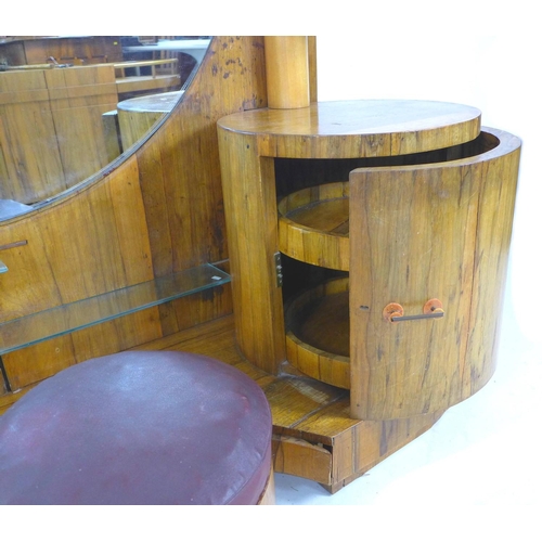 292 - An African ofram wood Art Deco style dressing table, with large circular mirror and an arrangement o... 