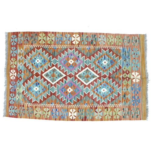 293 - A vegetable dyed wool Choli Kilim rug, with six principle diamond medallions to the geometric patter... 