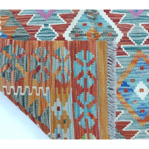 293 - A vegetable dyed wool Choli Kilim rug, with six principle diamond medallions to the geometric patter... 