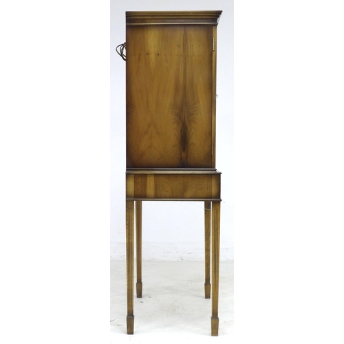 294 - A vintage Art Forma yew wood veneered drinks cocktail cabinet, with cupboard above two drawers, 62 b... 