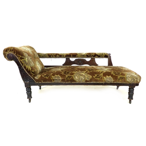 299 - A late Victorian mahogany chaise longue, with carved frame, turned legs and castors, upholstered in ... 