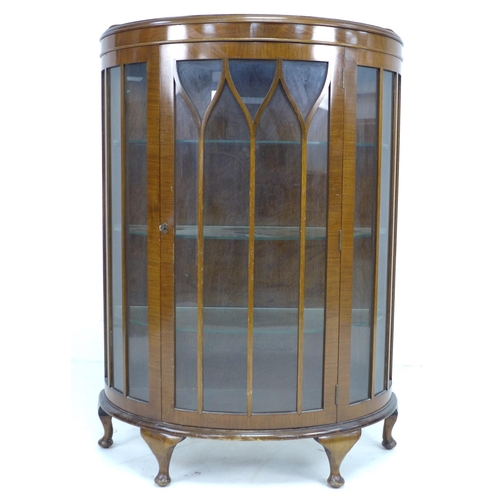 300 - A 1950's mahogany veneered demi-lune display cabinet, single astragal glazed door, three glass shelv... 