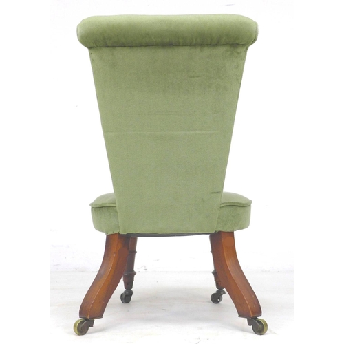 302 - An early 19th century rosewood nursing or prayer chair, later green velour upholstery, raised on tur... 