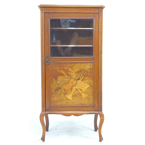 303 - An Edwardian mahogany music cabinet with later top, the door with glass above a marquetry panel depi... 