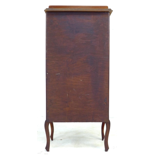 303 - An Edwardian mahogany music cabinet with later top, the door with glass above a marquetry panel depi... 