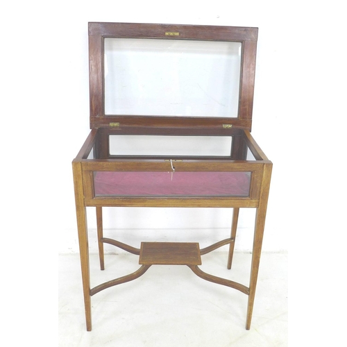 306 - An Edwardian mahogany and inlaid vitrine, lift top, X stretcher, raised on slender tapering legs, 63... 