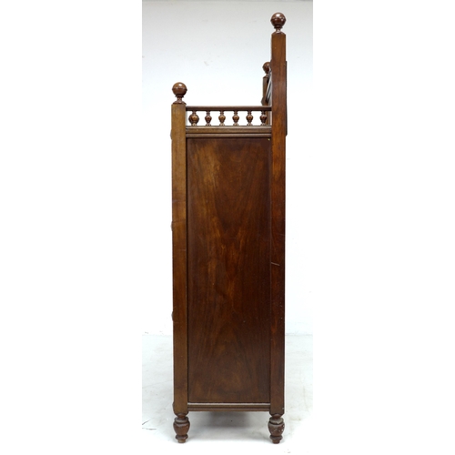 307 - A late 19th century Continental mahogany cabinet, with turned galley and mirrored upstand, twin door... 