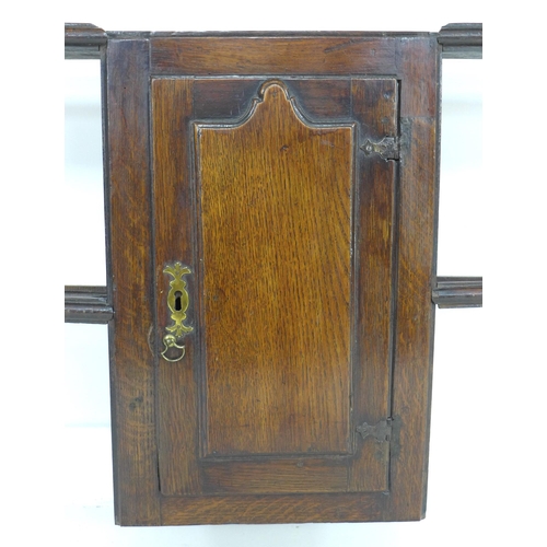 308 - A Georgian oak Welsh dresser rack top, with central cupboard, 145.5 by 19.5 by 105.5cm high.