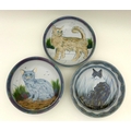 A group of Highland Stoneware pottery, comprising three large bowls each depicting cats, two signed,... 