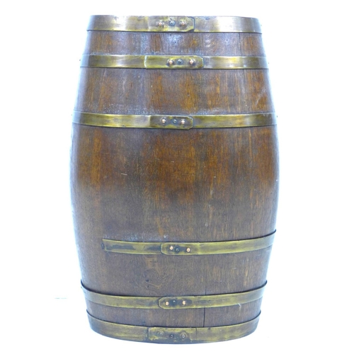 311 - A Victorian oak and brass bound coopered barrel, 37 by 30 by 61cm high.