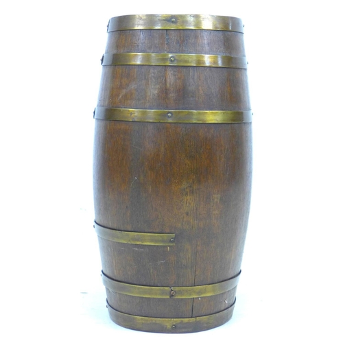 311 - A Victorian oak and brass bound coopered barrel, 37 by 30 by 61cm high.