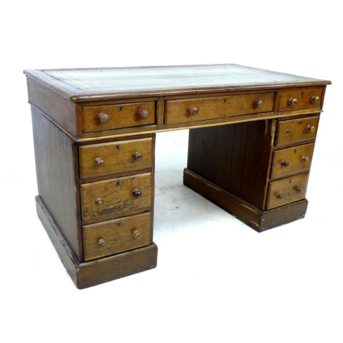 316 - An Edwardian oak pedestal desk, with inset leather top, nine drawers, a/f poor condition, 118 by 68 ... 