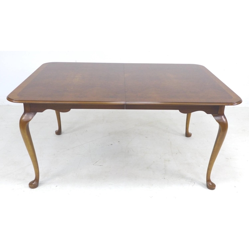 319 - A mid to late 20th century Queen Anne style extending dining table, by Ian James, with burr walnut v... 