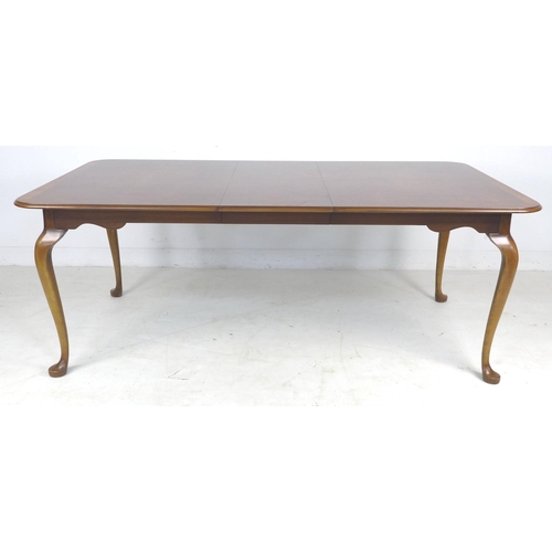 319 - A mid to late 20th century Queen Anne style extending dining table, by Ian James, with burr walnut v... 