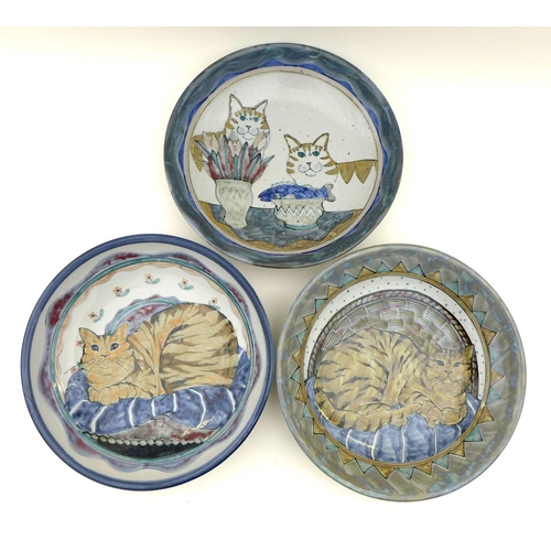 32 - A group of Highland Stoneware pottery, comprising three large bowls each depicting cats, all stamped... 