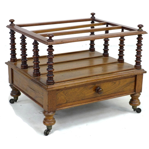 328 - An early Victorian rosewood Canterbury, three division, single drawer with turned knob, raised upon ... 