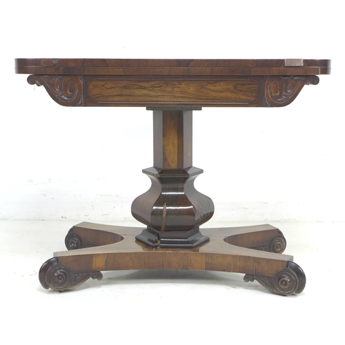 333 - A 19th century rosewood card table, with circular olive green baize, raised upon a single baluster f... 