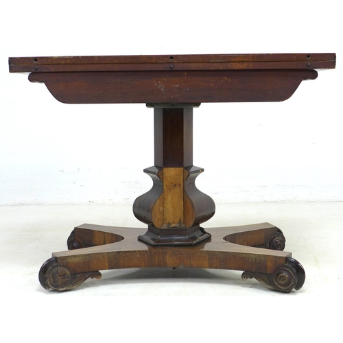 333 - A 19th century rosewood card table, with circular olive green baize, raised upon a single baluster f... 