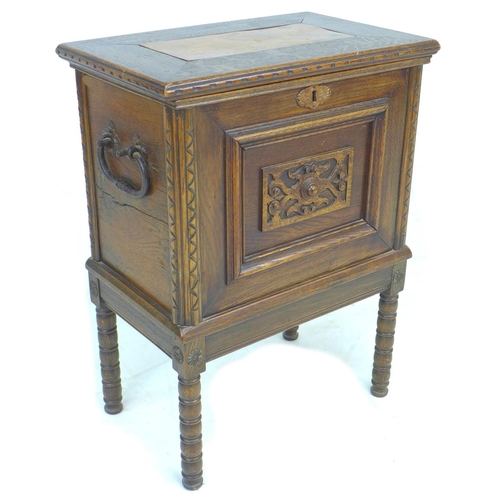 345 - A 20th century oak chest on stand, the lift lid with elm inlay and large brass hinges opening to rev... 