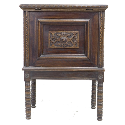 345 - A 20th century oak chest on stand, the lift lid with elm inlay and large brass hinges opening to rev... 