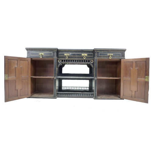 346 - A Victorian Gothic breakfront sideboard, ebonised and gilt highlighted, three frieze drawers with br... 