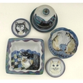 A group of Highland Stoneware pottery all depicting cats, comprising one medium bowl, one square dis... 