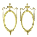 A pair of early 19th century Neoclassical taste gilt composition wall mirrors, in Hepplewhite, Rober... 