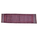 A Meshwari runner with dark red ground, six diamond patterns to white flower speckled field, with bl... 