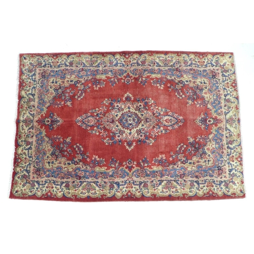 367 - A Hamadan rug with red ground, central cream and blue medallion with conforming corners, floral bord... 