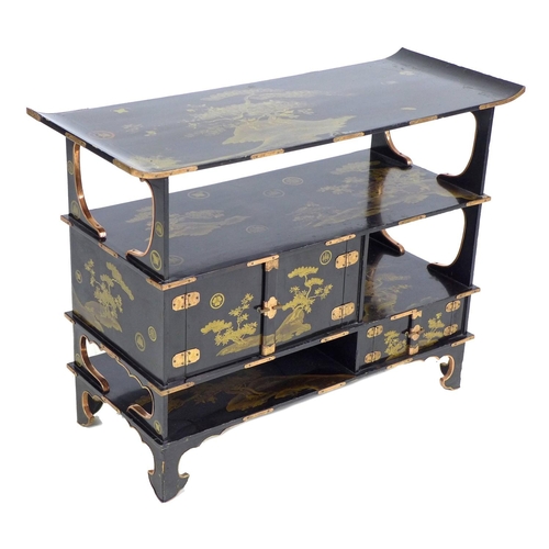 369 - A low Japanese black lacquer shelf unit, Meiji period, with engraved copper mountings, decorated in ... 