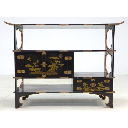 369 - A low Japanese black lacquer shelf unit, Meiji period, with engraved copper mountings, decorated in ... 