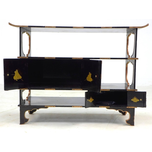 369 - A low Japanese black lacquer shelf unit, Meiji period, with engraved copper mountings, decorated in ... 