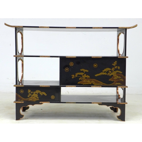 369 - A low Japanese black lacquer shelf unit, Meiji period, with engraved copper mountings, decorated in ... 