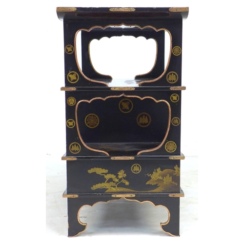 369 - A low Japanese black lacquer shelf unit, Meiji period, with engraved copper mountings, decorated in ... 