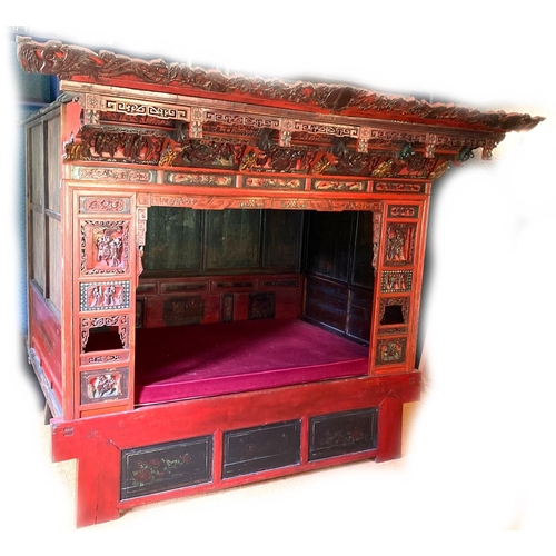 370 - A Chinese wedding bed, Qing Dynasty, late 19th / early 20th century, with carved, painted, and gilt ... 