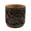 A Chinese bamboo brush pot, bitong, Qing Dynasty, late 19th century, carved in relief with four pane... 