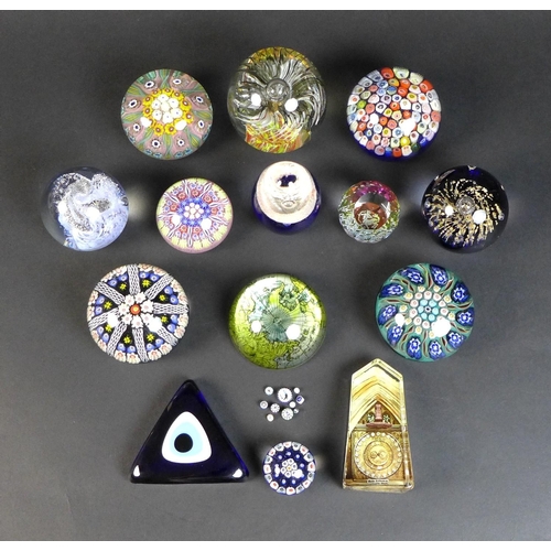 42 - A group of fourteen various paperweights, including five millefiori paperweights, featuring a small ... 